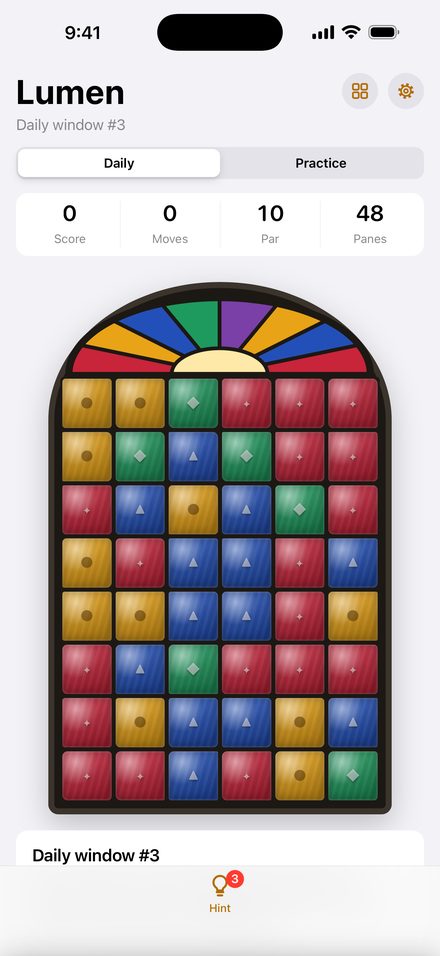Today's window: a grid of red, blue, amber and green panes under a stained-glass arch